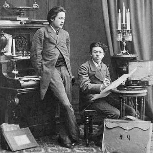 Photograph. A young Chekhov caught unaware of the camera, admiring his brother Nikolai’s artwork.