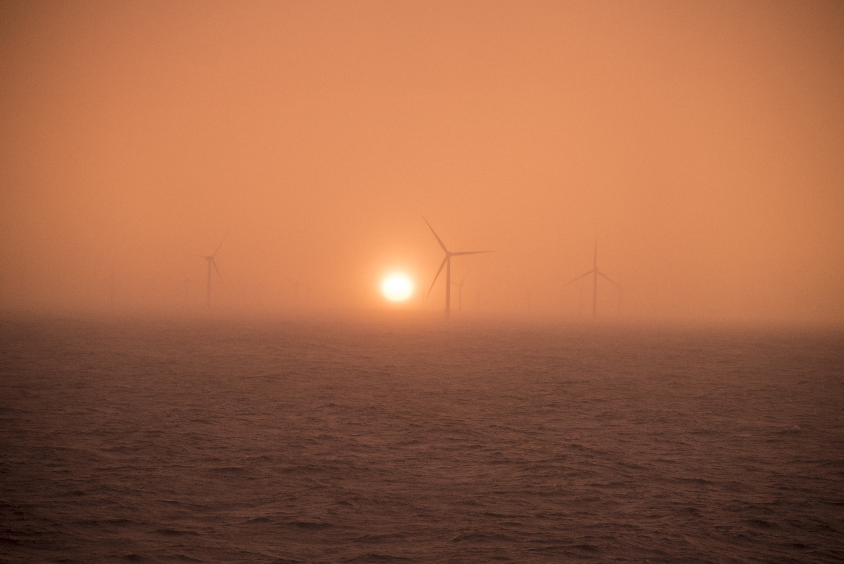 Sunset off Whitstable wind farm off the coast of Kent, England