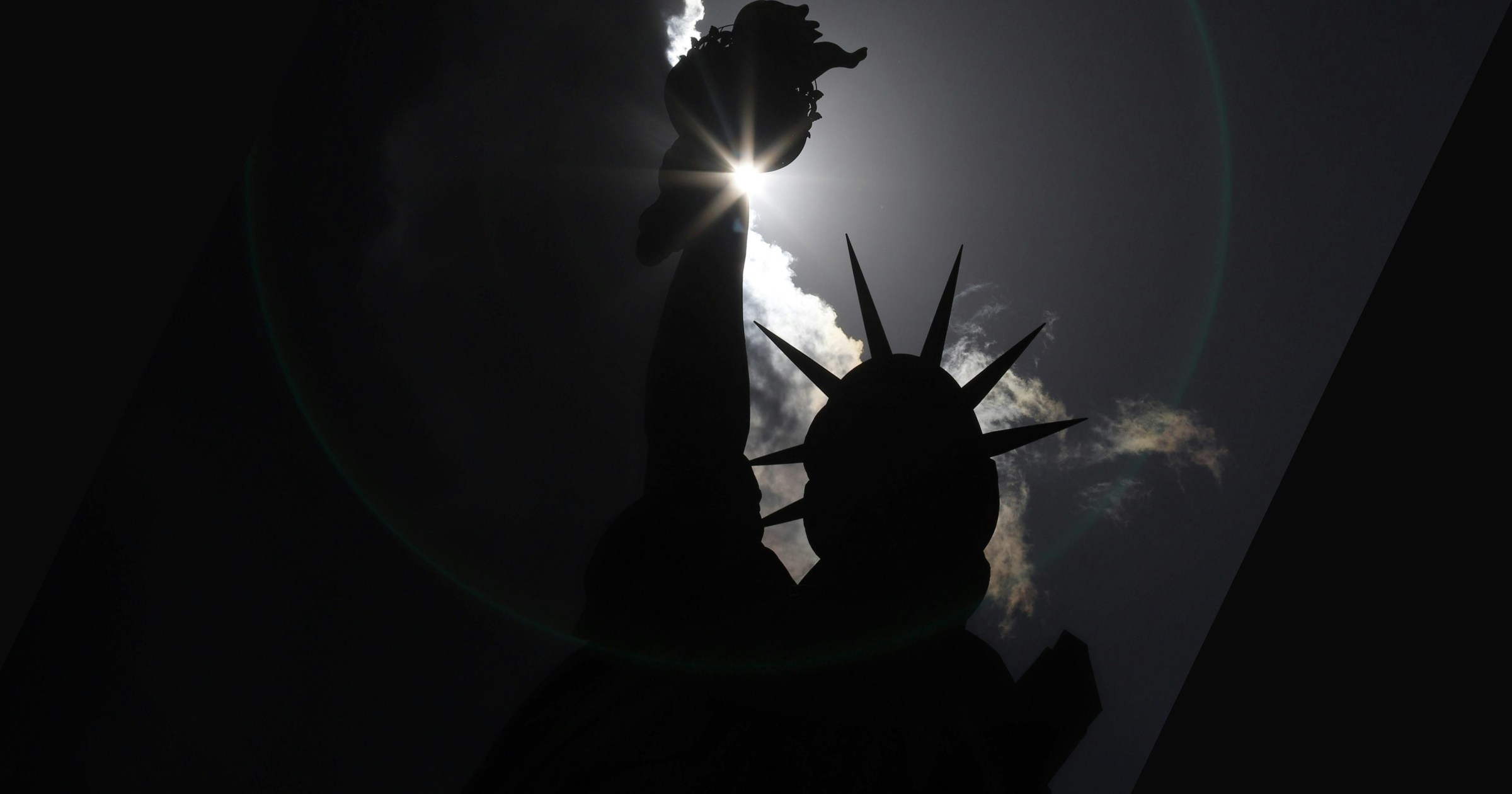 The Statue of Liberty is overtaken by shadows